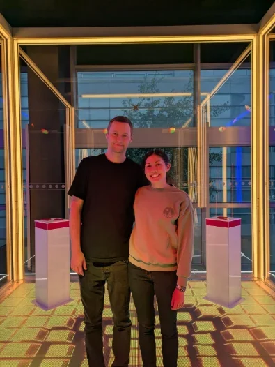 Two people visiting an exhibition