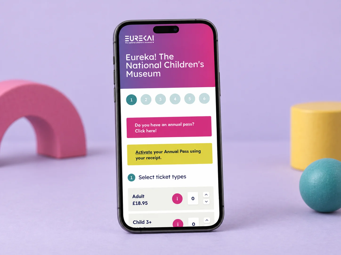 Eureka! museum ticket booking on a mobile phone, including annual-pass options and ticket selection.